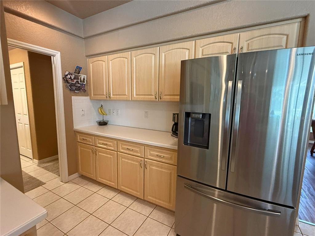 7552 River Country Drive Weeki Wachee, FL 34607 - Photo 24 of 59 a kitchen with stainless steel appliances granite countertop a refrigerator and a sink