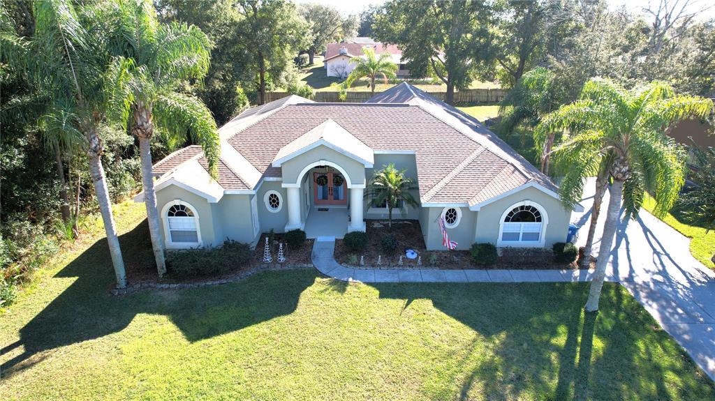 7552 River Country Drive Weeki Wachee, FL 34607 - Photo 3 of 59 a front view of house with yard and green space