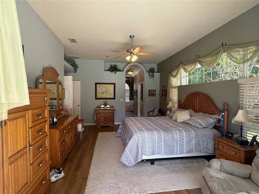 7552 River Country Drive Weeki Wachee, FL 34607 - Photo 31 of 59 a bedroom with a bed dresser and a window