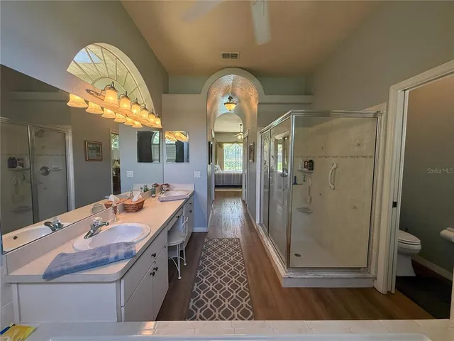 a white toilet sitting next to a sink