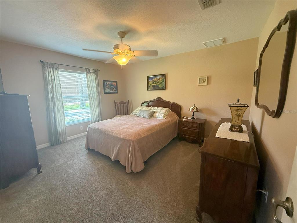 7552 River Country Drive Weeki Wachee, FL 34607 - Photo 40 of 59 a bedroom with bed and a window