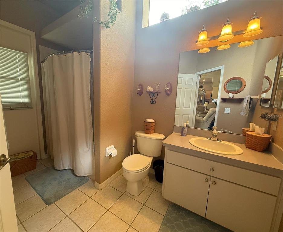 7552 River Country Drive Weeki Wachee, FL 34607 - Photo 43 of 59 a bathroom with a toilet sink and mirror