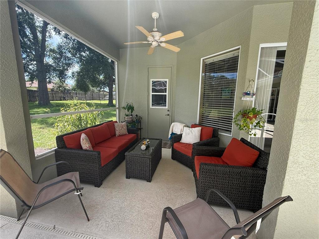 7552 River Country Drive Weeki Wachee, FL 34607 - Photo 47 of 59 a living room with furniture and a floor to ceiling window