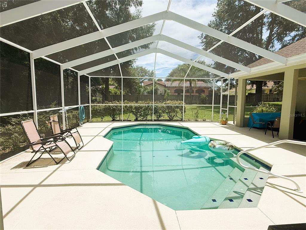 7552 River Country Drive Weeki Wachee, FL 34607 - Photo 48 of 59 a swimming pool with a outdoor seating