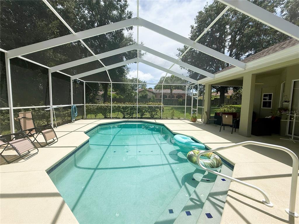 7552 River Country Drive Weeki Wachee, FL 34607 - Photo 53 of 59 a view of a backyard with furniture and tub