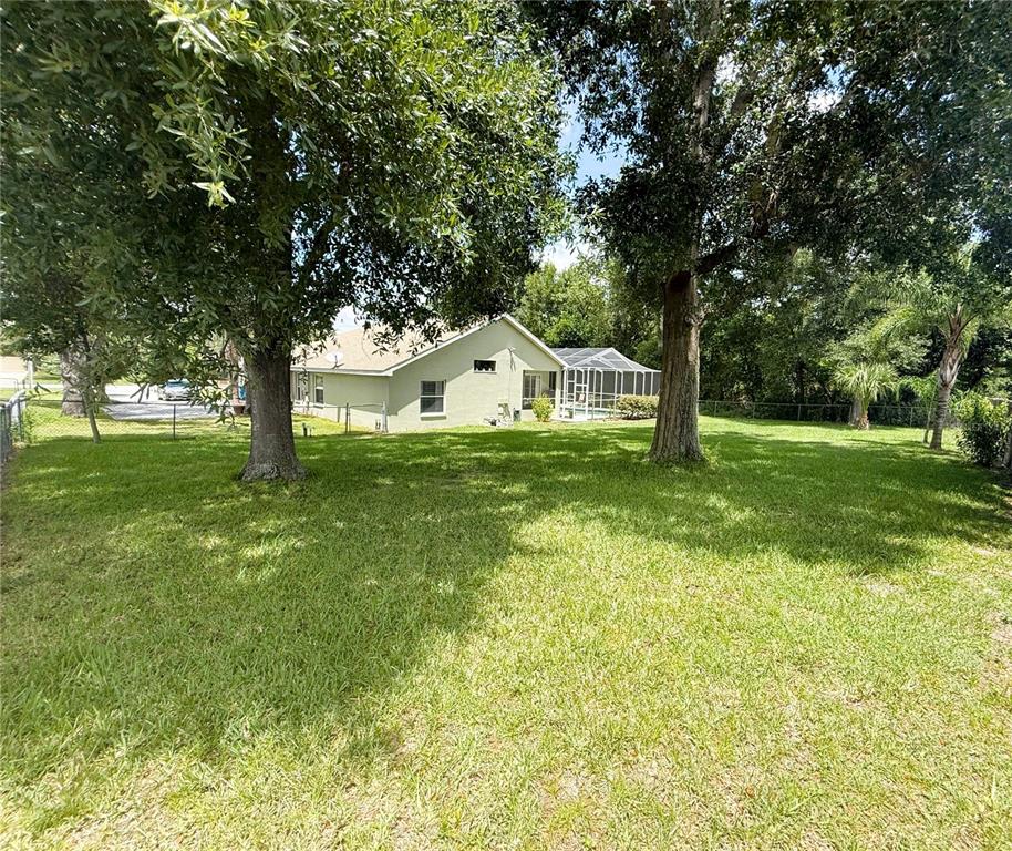 7552 River Country Drive Weeki Wachee, FL 34607 - Photo 57 of 59 a view of a house with a yard