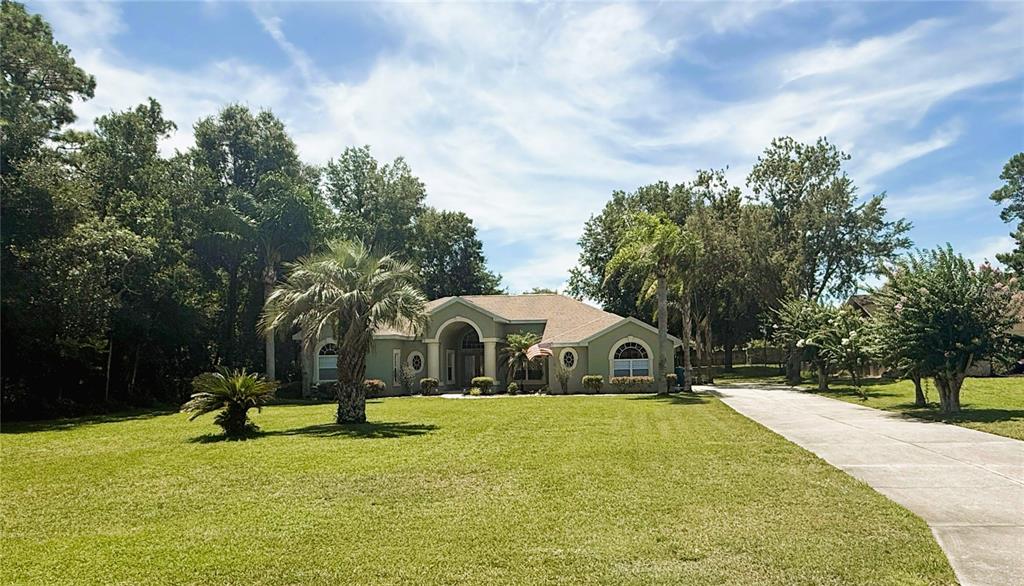 7552 River Country Drive Weeki Wachee, FL 34607 - Photo 9 of 59 a view of swimming pool with a garden