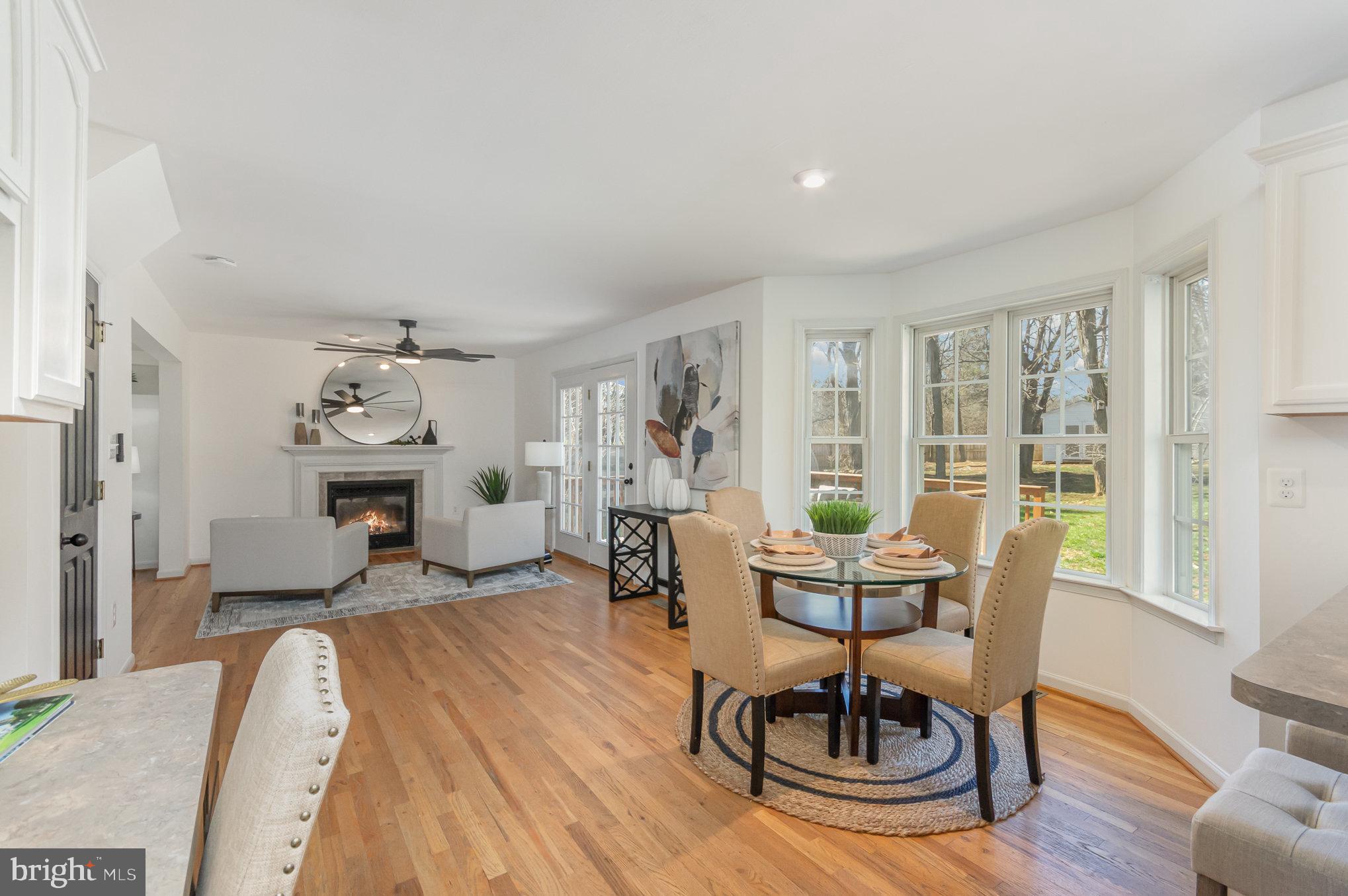 149 Rome Drive Clear Brook, VA 22624 - Photo 11 of 36 a living room with furniture a dining table and a potted plant