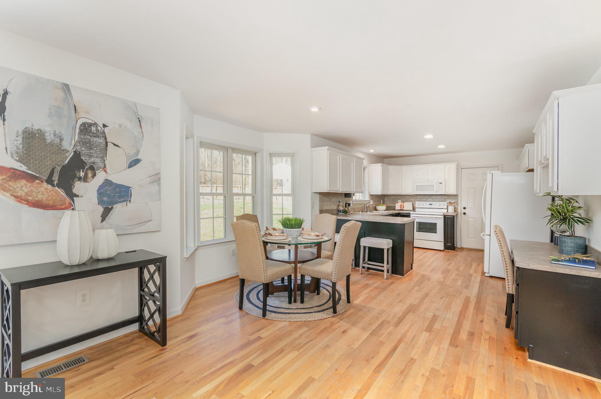 149 Rome Drive Clear Brook, VA 22624 - Photo 12 of 36 a living room with furniture and a dining table with kitchen view
