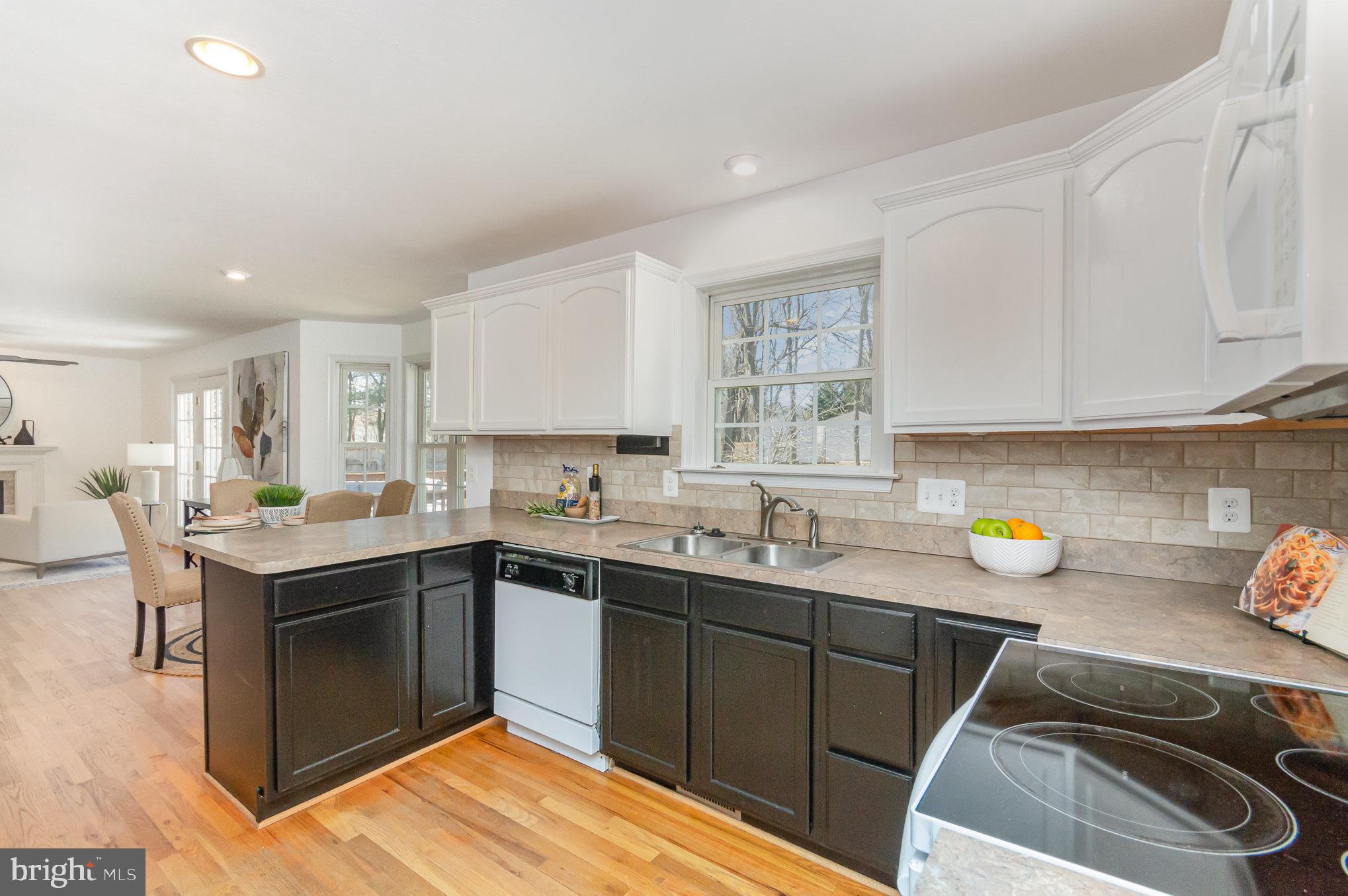 149 Rome Drive Clear Brook, VA 22624 - Photo 13 of 36 a kitchen with a sink a stove and cabinets