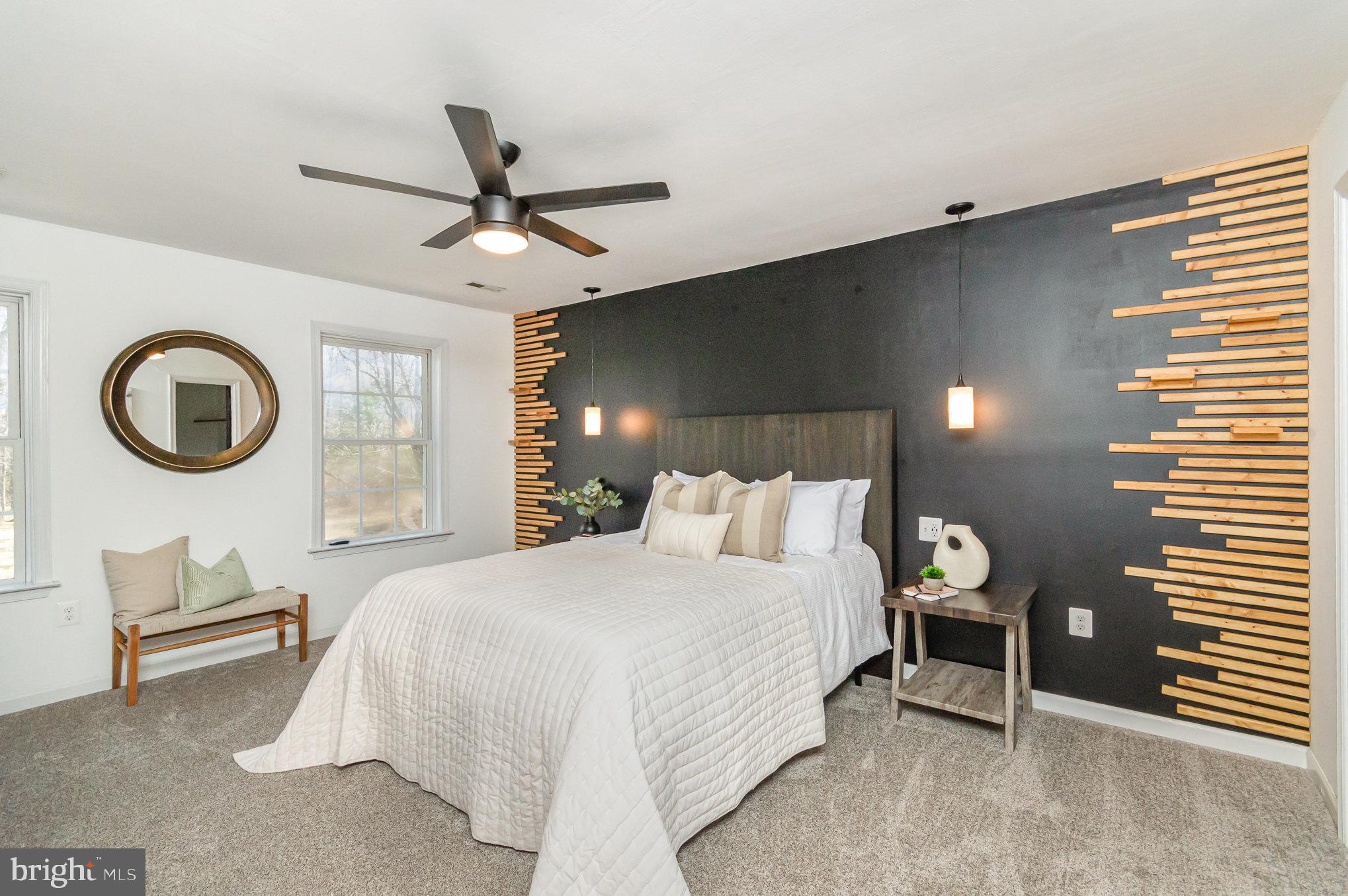 149 Rome Drive Clear Brook, VA 22624 - Photo 16 of 36 a bedroom with a bed and a chandelier