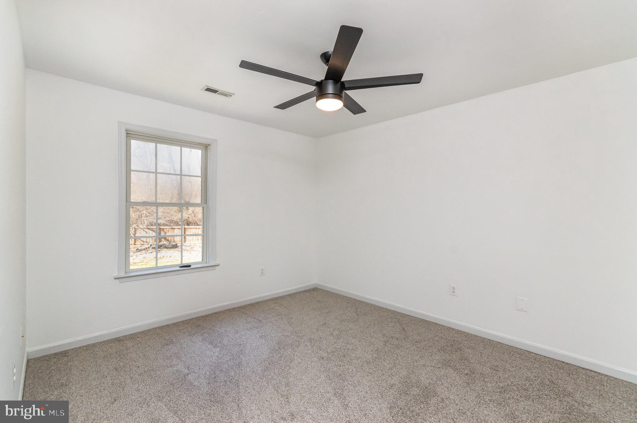 149 Rome Drive Clear Brook, VA 22624 - Photo 23 of 36 an empty room with a window and a fan
