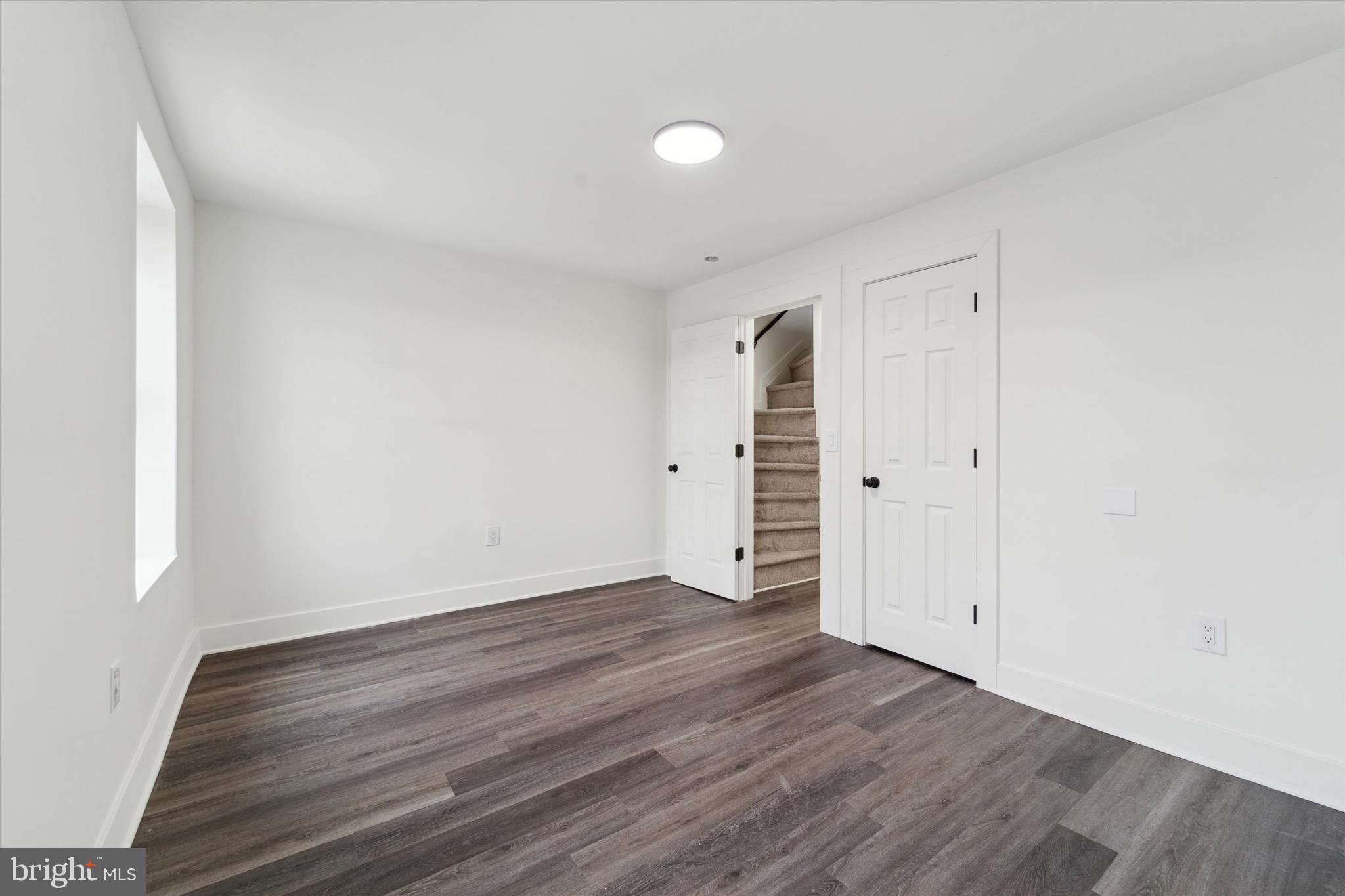 316 East 11th Street Chester, PA 19013 - Photo 15 of 28 a view of an empty room with wooden floor