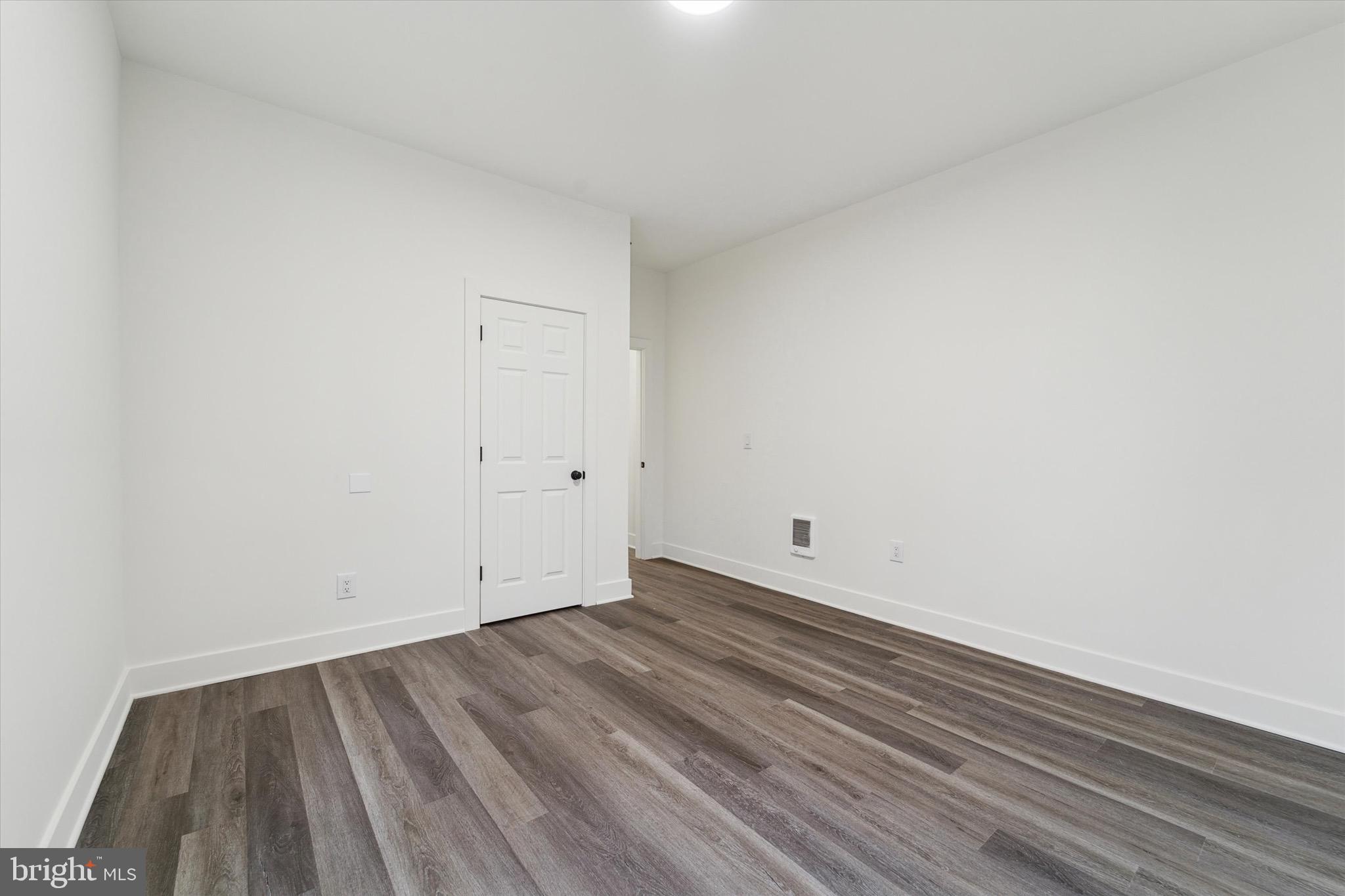 316 East 11th Street Chester, PA 19013 - Photo 22 of 28 a view of room with wooden floor