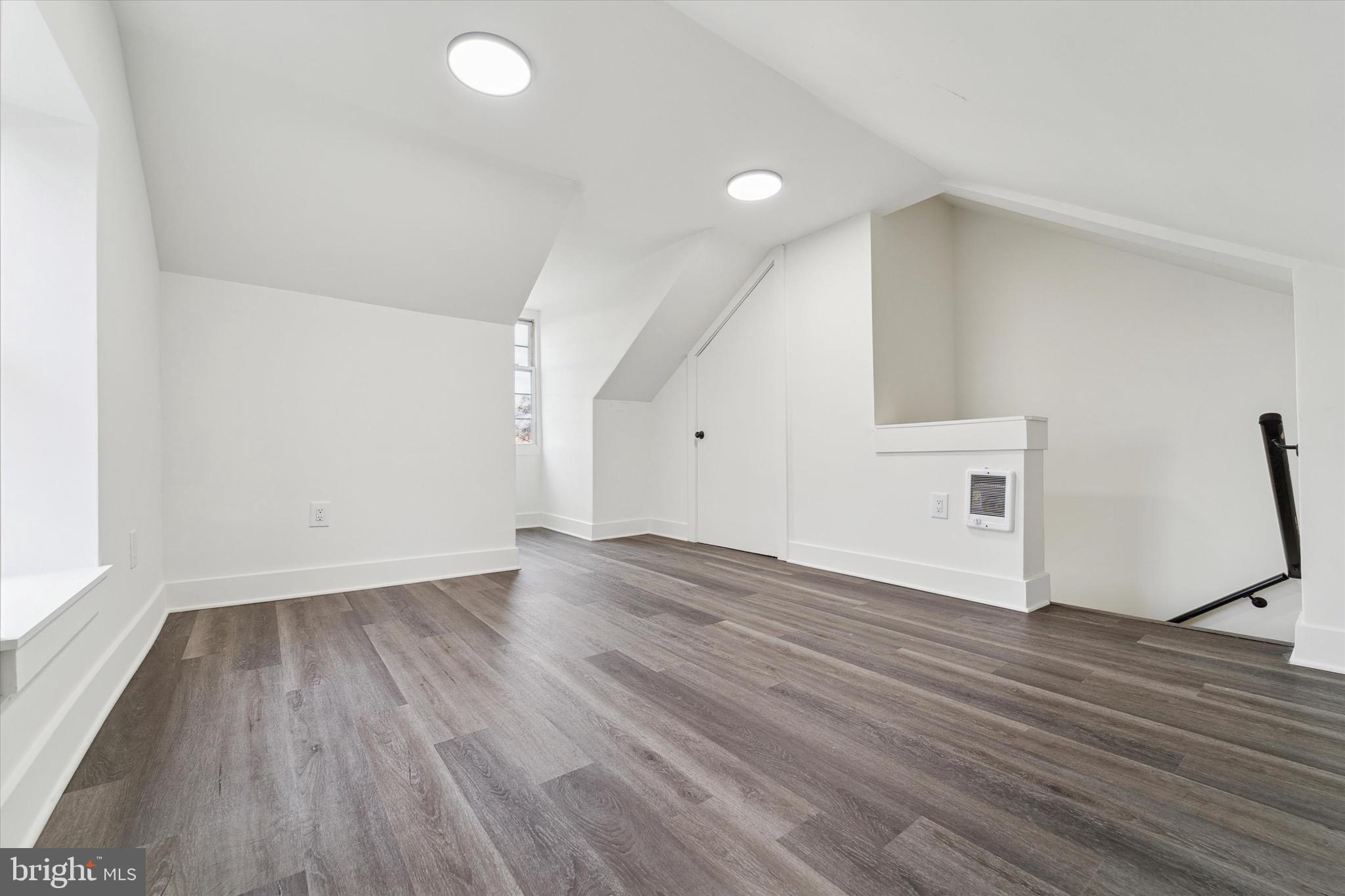 316 East 11th Street Chester, PA 19013 - Photo 25 of 28 an empty room with wooden floor and windows