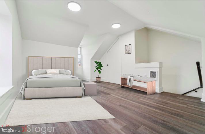 316 East 11th Street Chester, PA 19013 - Photo 26 of 28 a bedroom with a bed and a couch