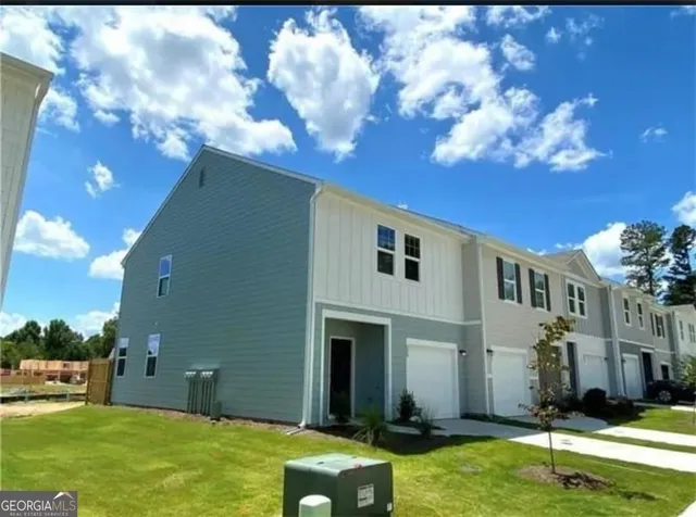 a backyard with a table and chairs