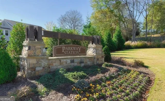 a view of a park with a bench and trees