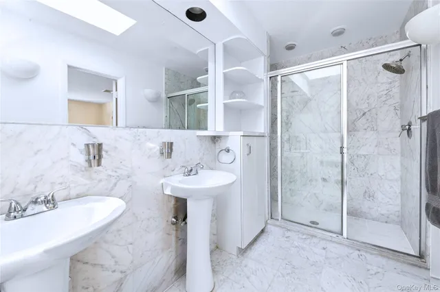 a bathroom with a sink and mirror
