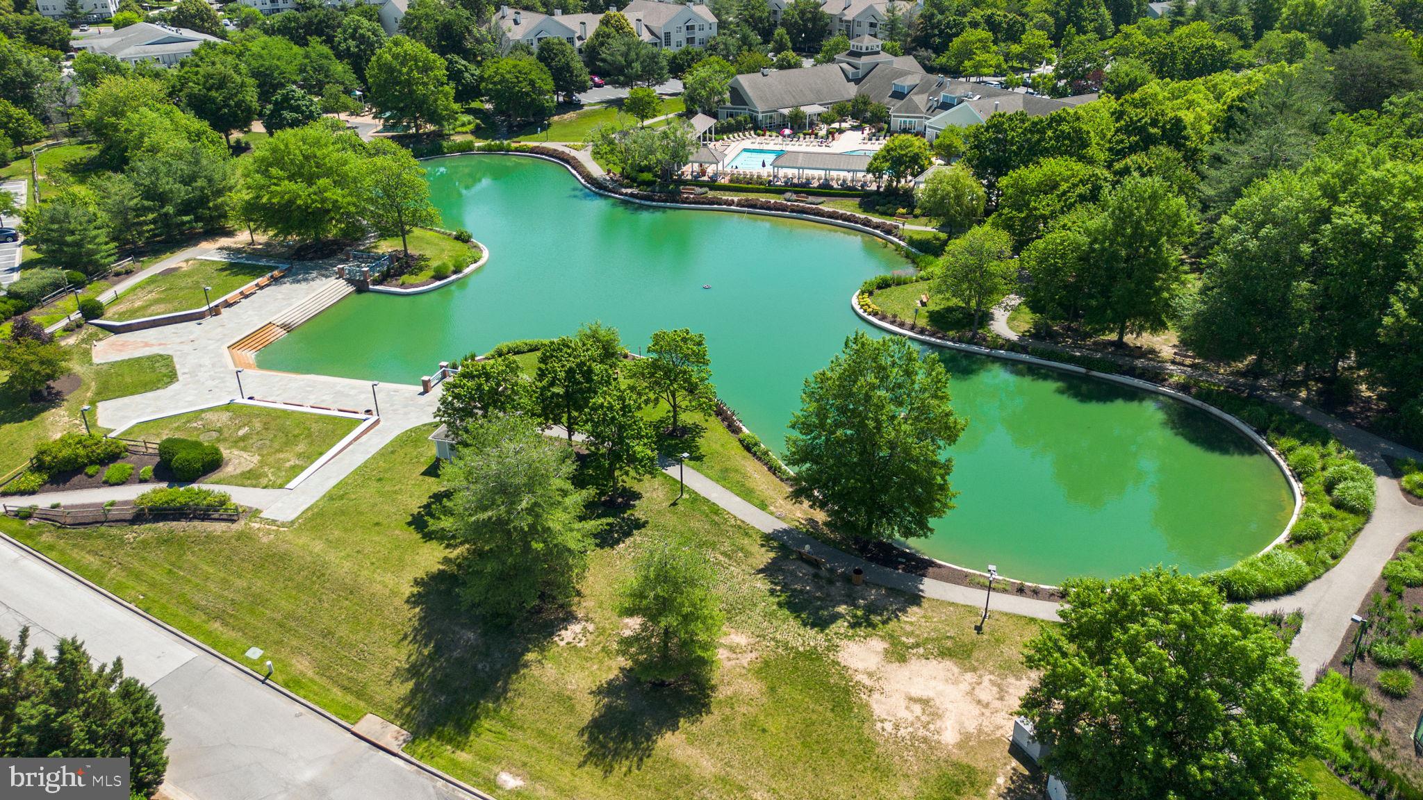 2444 Blue Spring Court, Unit 203 Odenton, MD 21113 - Photo 31 of 36 an aerial view of residential houses with outdoor space and lake view