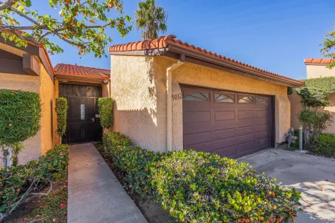 a view of a pathway along the house