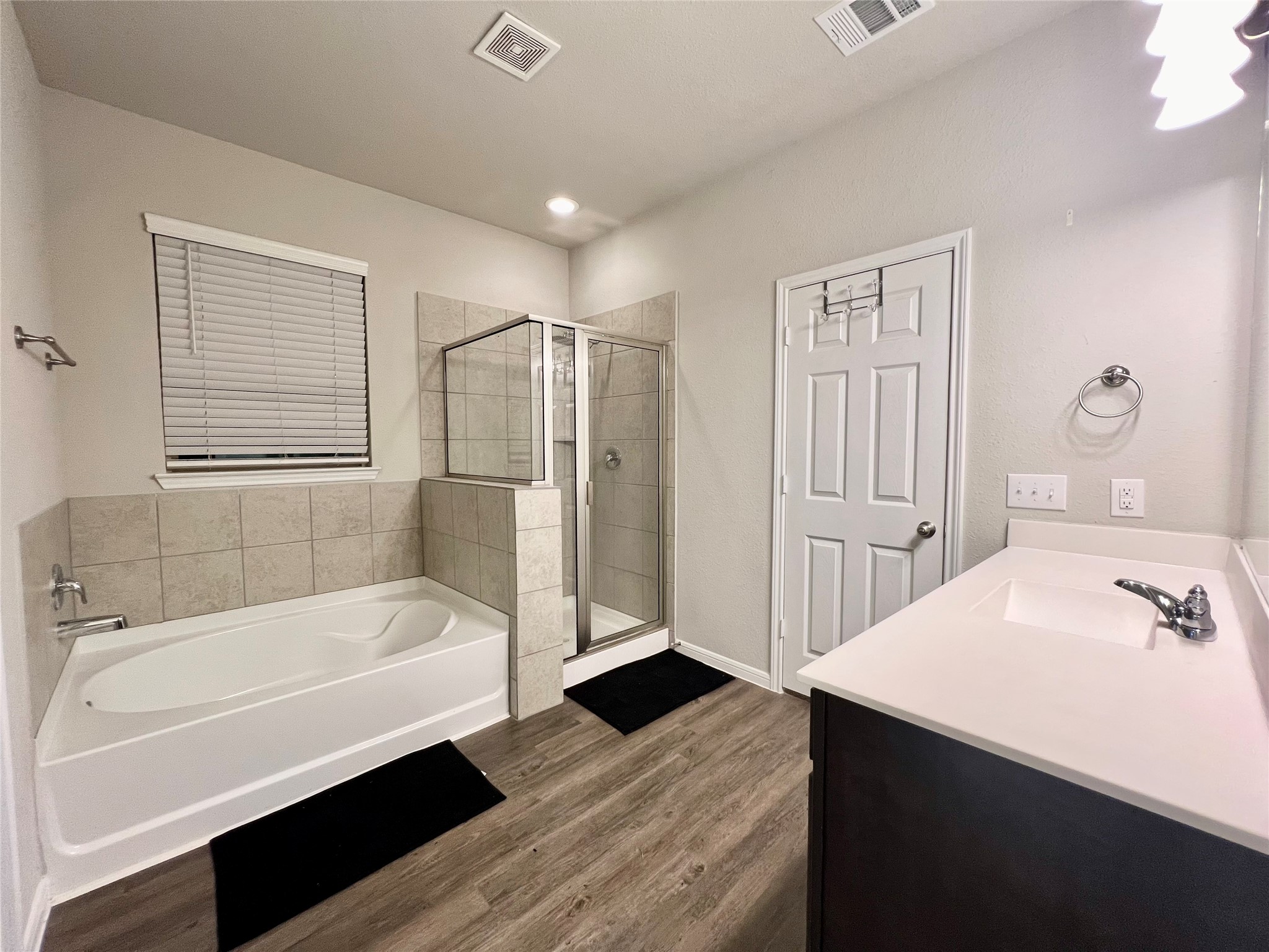 10036 Gold Finch Run Magnolia, TX 77354 - Photo 9 of 17 Large soaking tub and sleek shower.