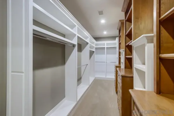 a bedroom with a large bed and a large window