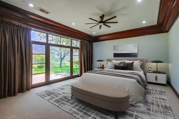a bed room with a bed and a television
