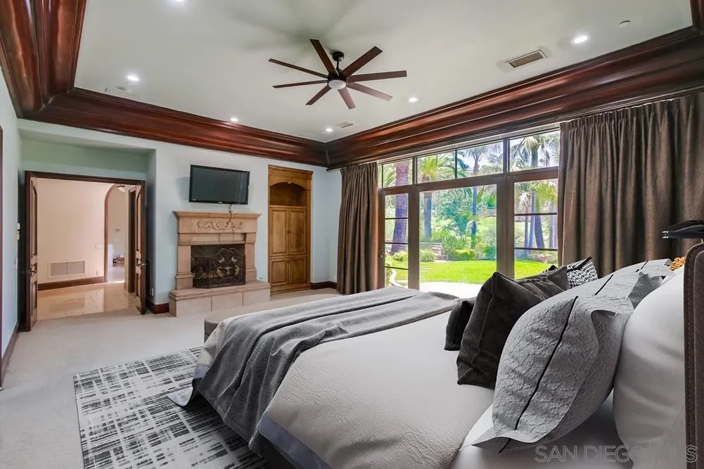 14175 Biscayne Place Poway, CA 92064 - Photo 17 of 65 a bed sitting in a spacious bedroom next to a window