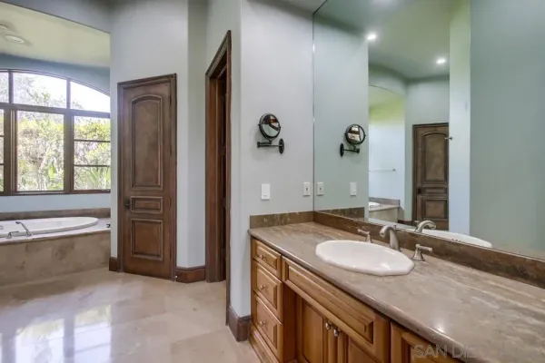 a kitchen with stainless steel appliances granite countertop a stove and a sink