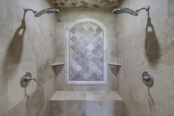 a bathroom with a glass shower door