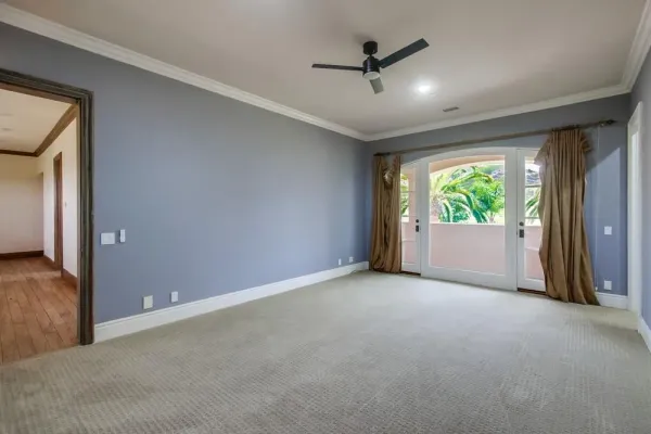 a spacious bathroom with a granite countertop sink a toilet and shower