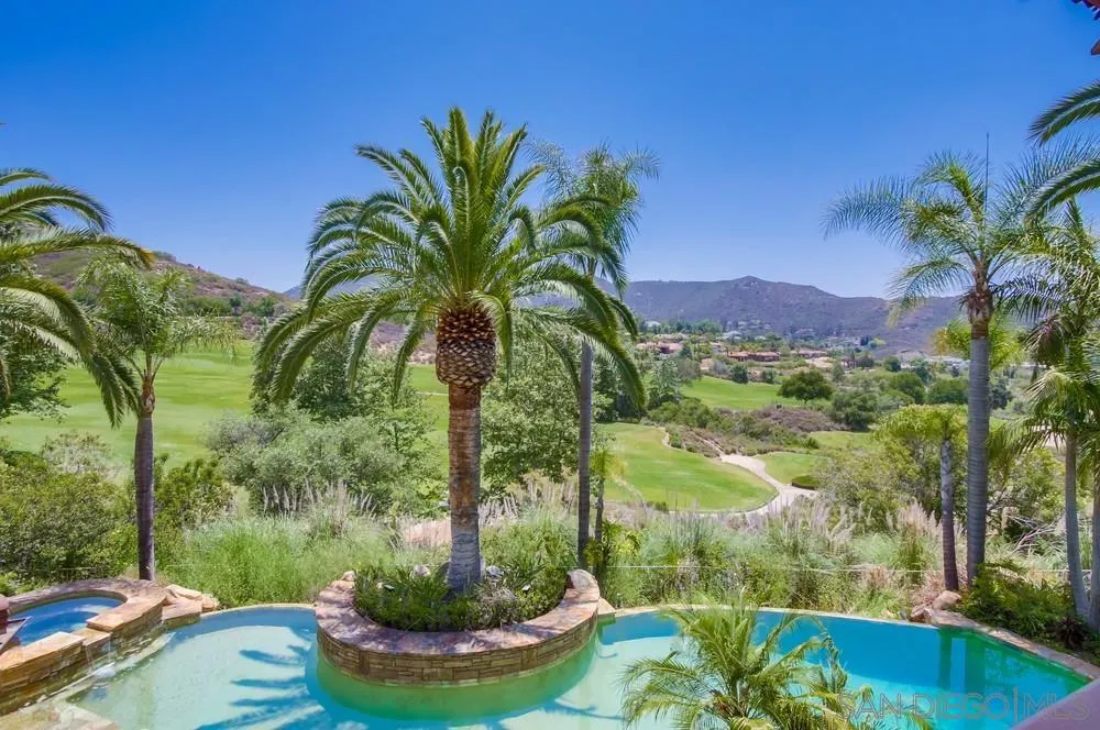 14175 Biscayne Place Poway, CA 92064 - Photo 45 of 65 a view of a swimming pool with a yard