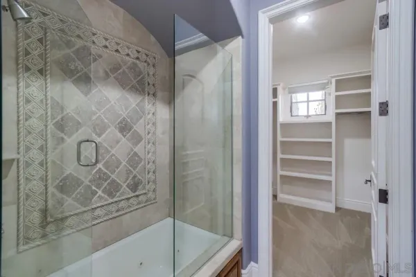 a view of an empty walk in closet
