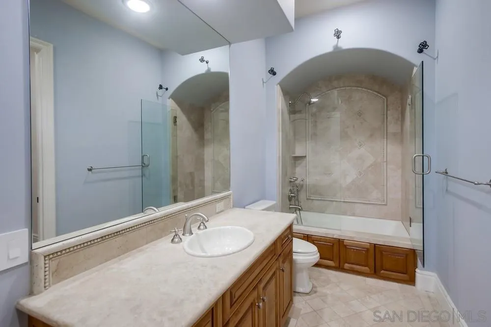 14175 Biscayne Place Poway, CA 92064 - Photo 54 of 65 a spacious bathroom with a granite countertop sink a toilet and shower