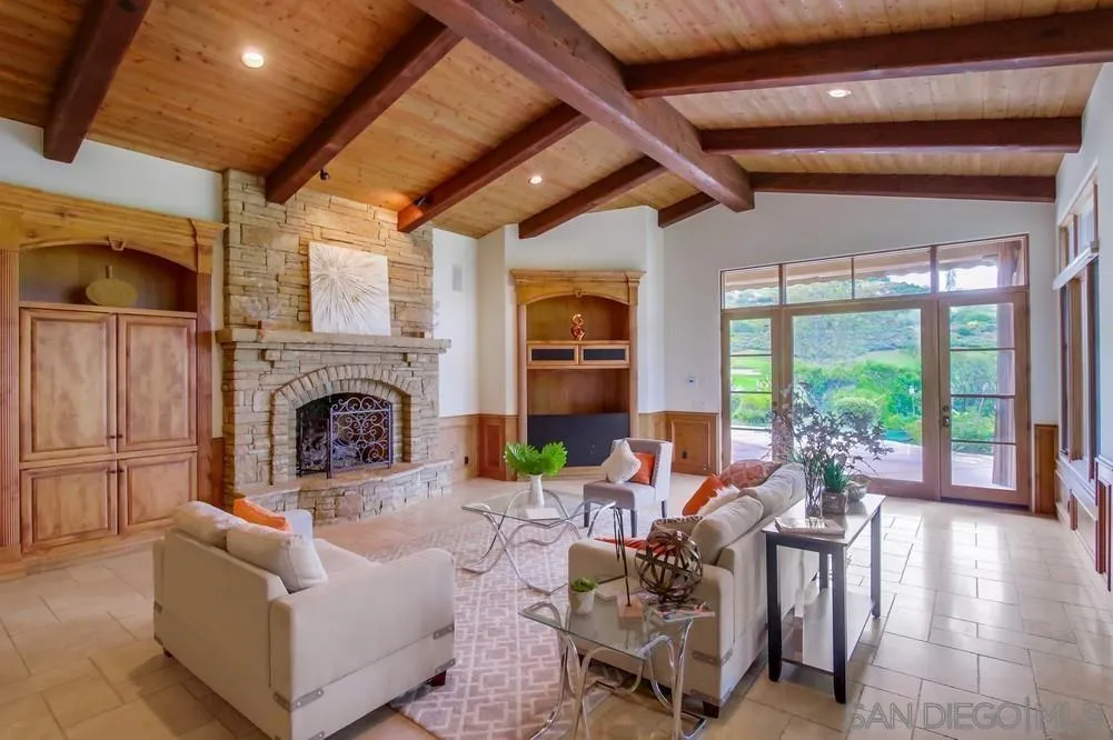 14175 Biscayne Place Poway, CA 92064 - Photo 6 of 65 a living room with furniture fireplace and a large window