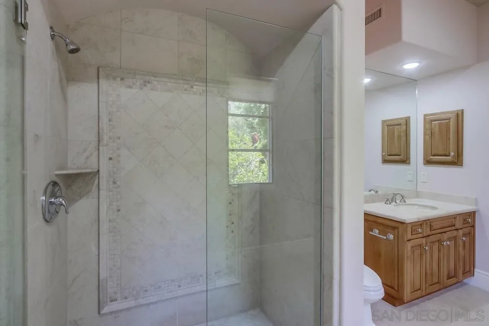 14175 Biscayne Place Poway, CA 92064 - Photo 61 of 65 a bathroom with a sink a toilet and shower