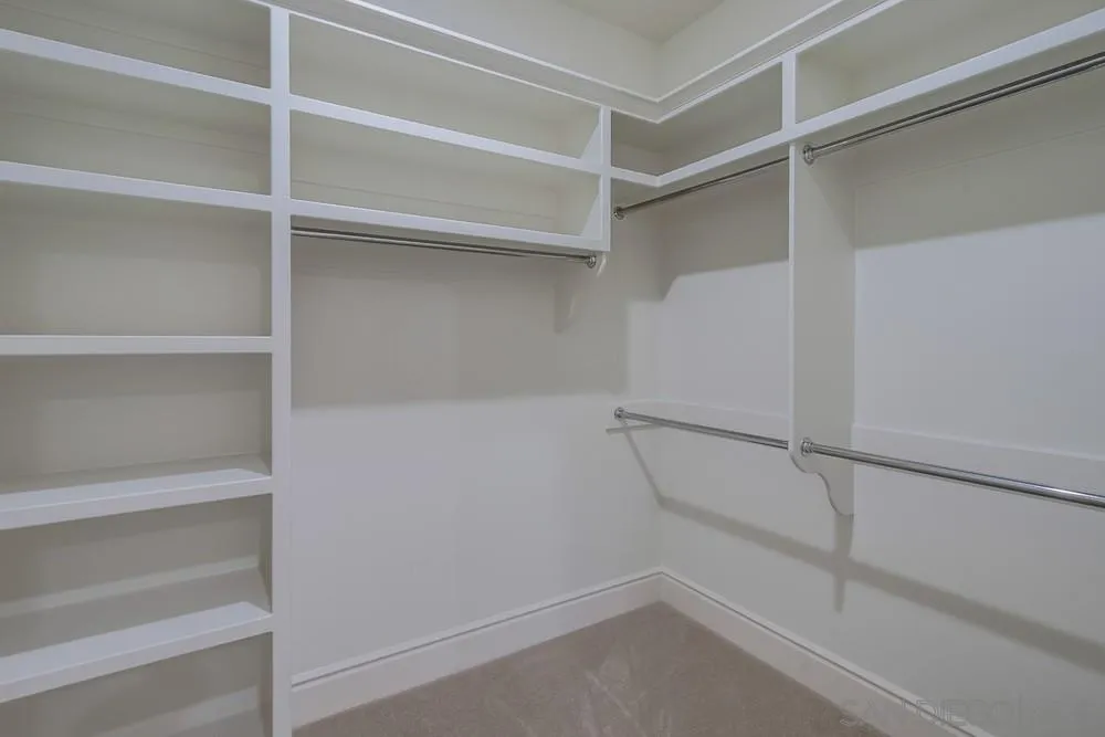 14175 Biscayne Place Poway, CA 92064 - Photo 62 of 65 a view of an empty walk in closet