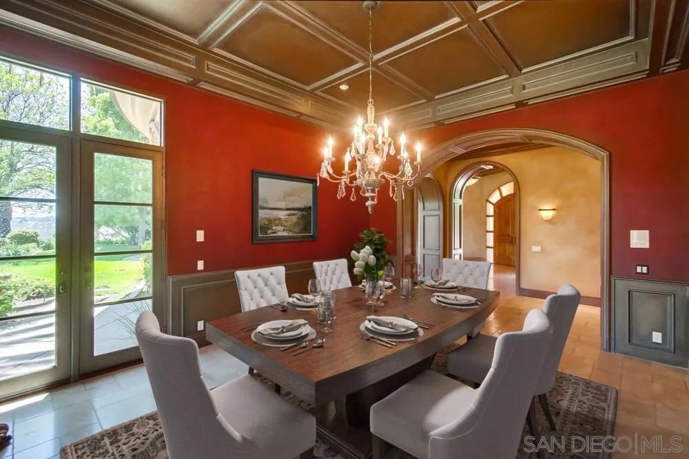 14175 Biscayne Place Poway, CA 92064 - Photo 9 of 65 a view of a dining room with furniture a chandelier and large windows