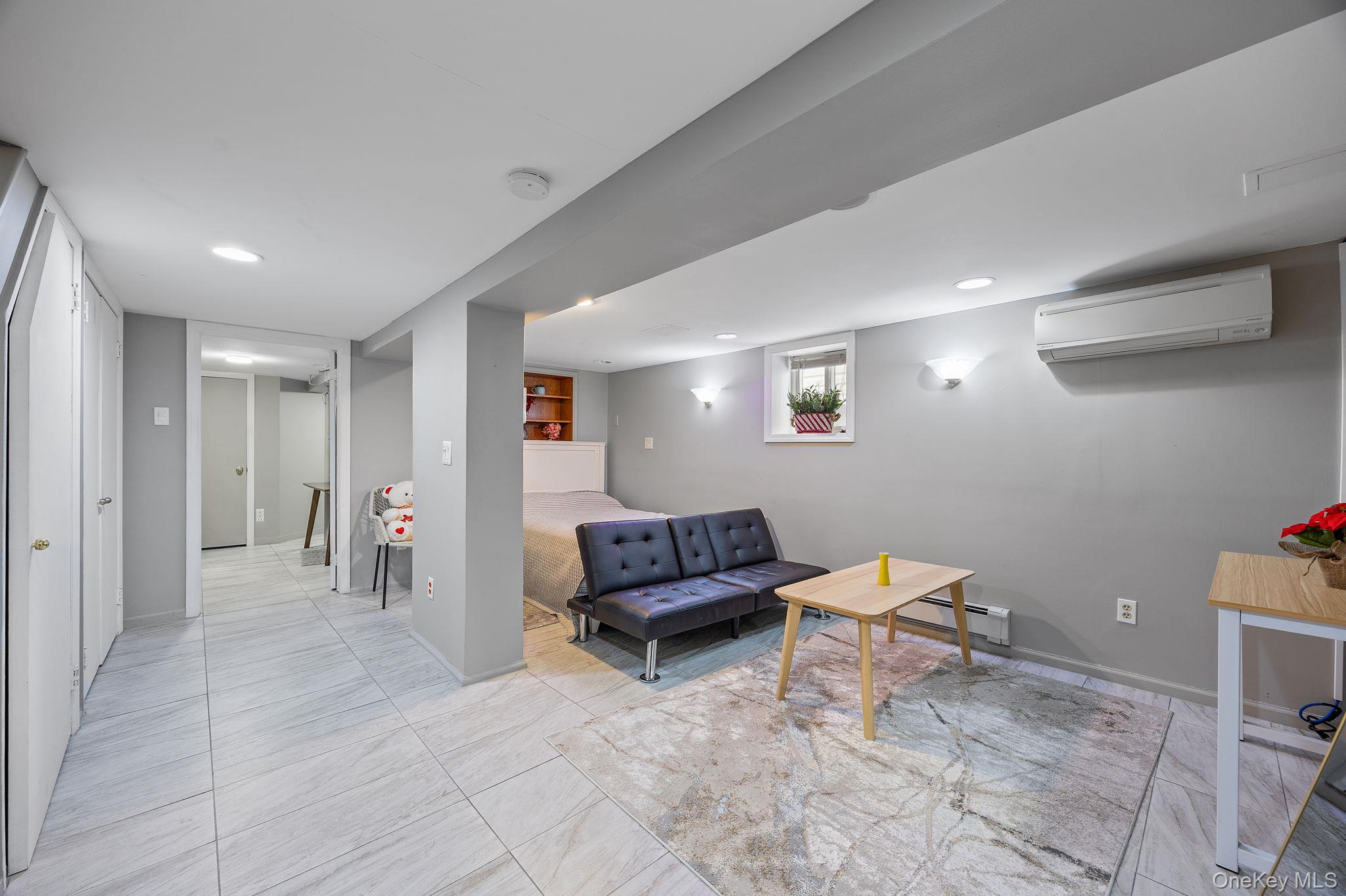72-15 Juniper Valley Road Queens, NY 11379 - Photo 11 of 15 a living room with furniture and a couch