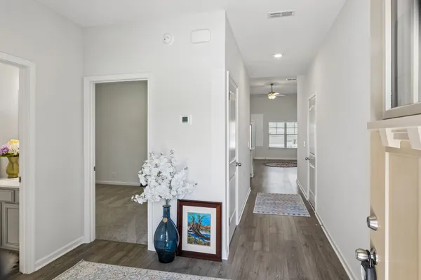 a kitchen with stainless steel appliances granite countertop a sink a refrigerator and a stove