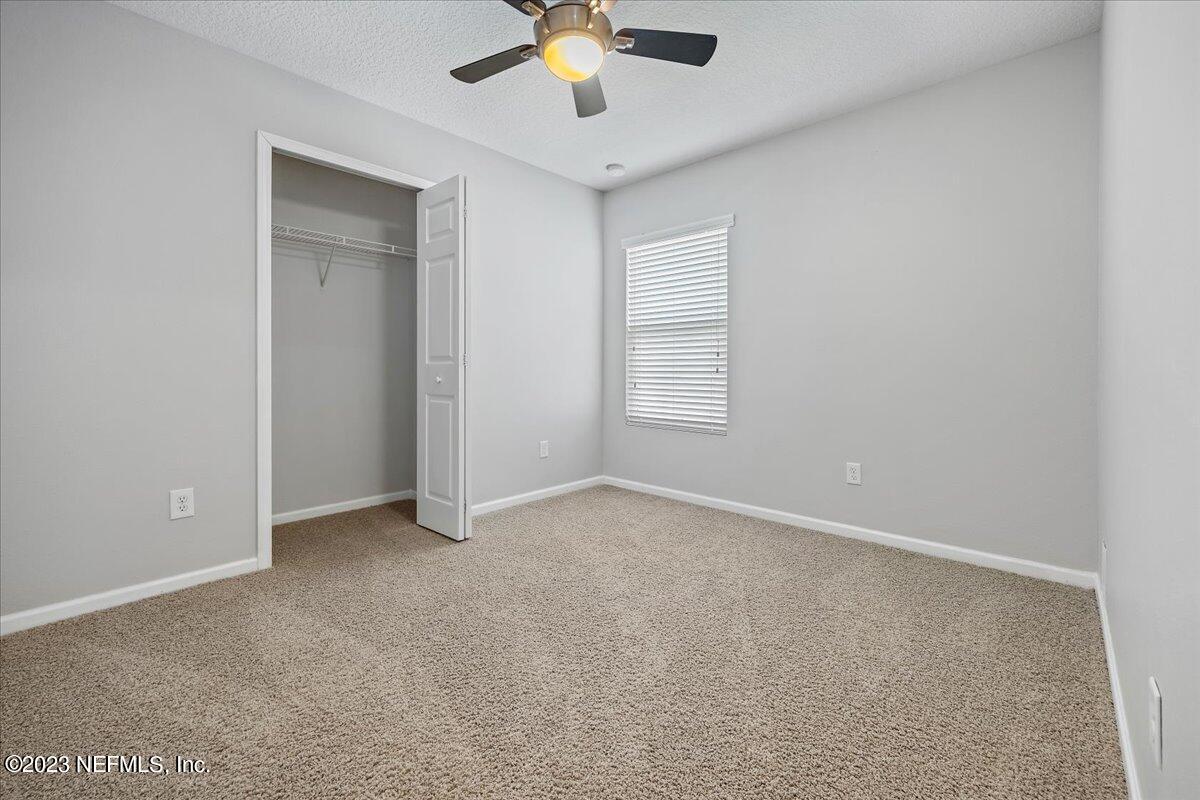 4046 Trail Ridge Road Middleburg, FL 32068 - Photo 14 of 22 an empty room with chandelier fan