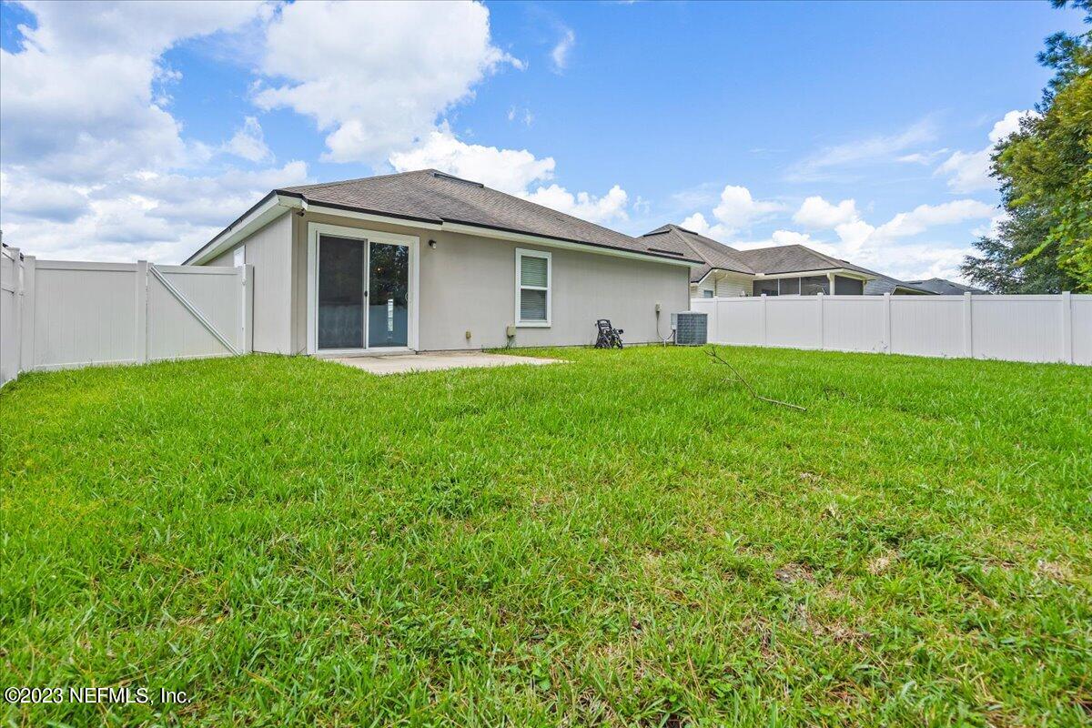 4046 Trail Ridge Road Middleburg, FL 32068 - Photo 19 of 22 a view of a house with a yard and front view of a house
