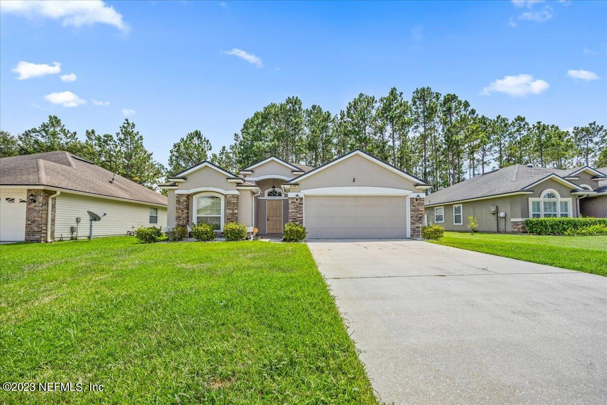 4046 Trail Ridge Road Middleburg, FL 32068 - Photo 20 of 22 a front view of a house with garden
