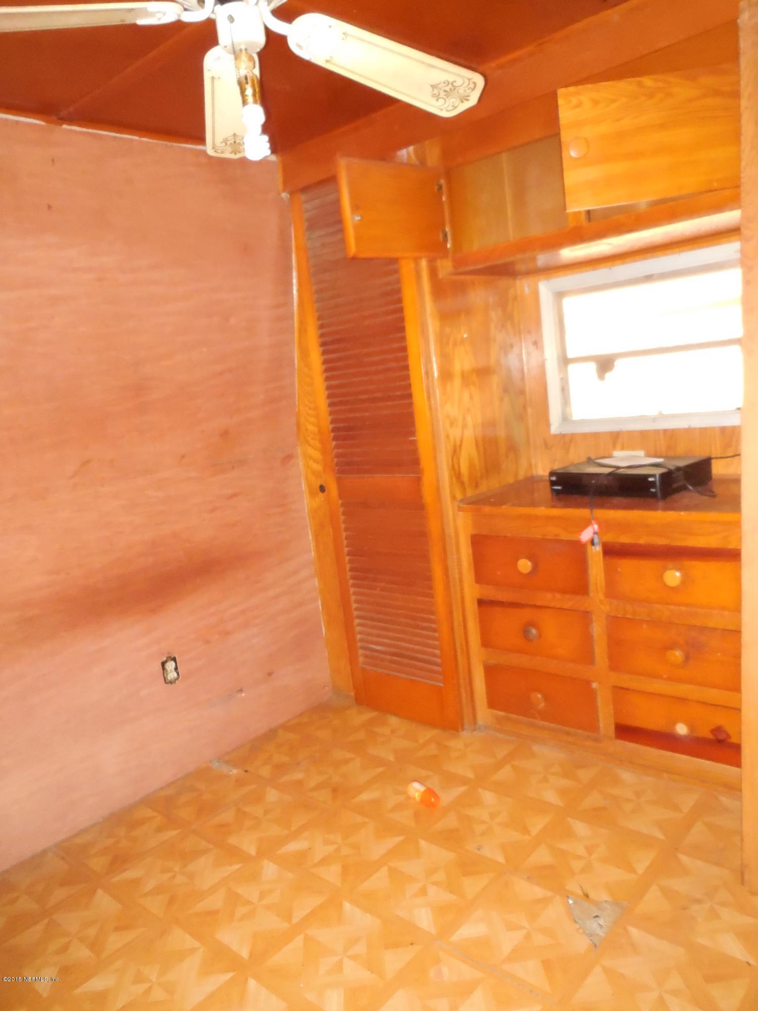 158 Oak Run Road Crescent City, FL 32112 - Photo 13 of 18 a view of walk in closet with empty room
