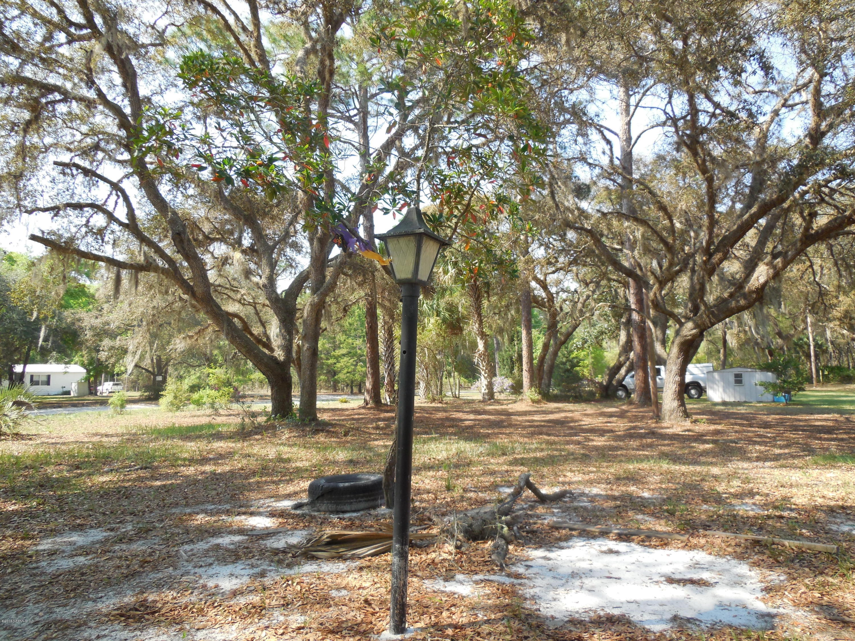 158 Oak Run Road Crescent City, FL 32112 - Photo 3 of 18 a view of road with trees