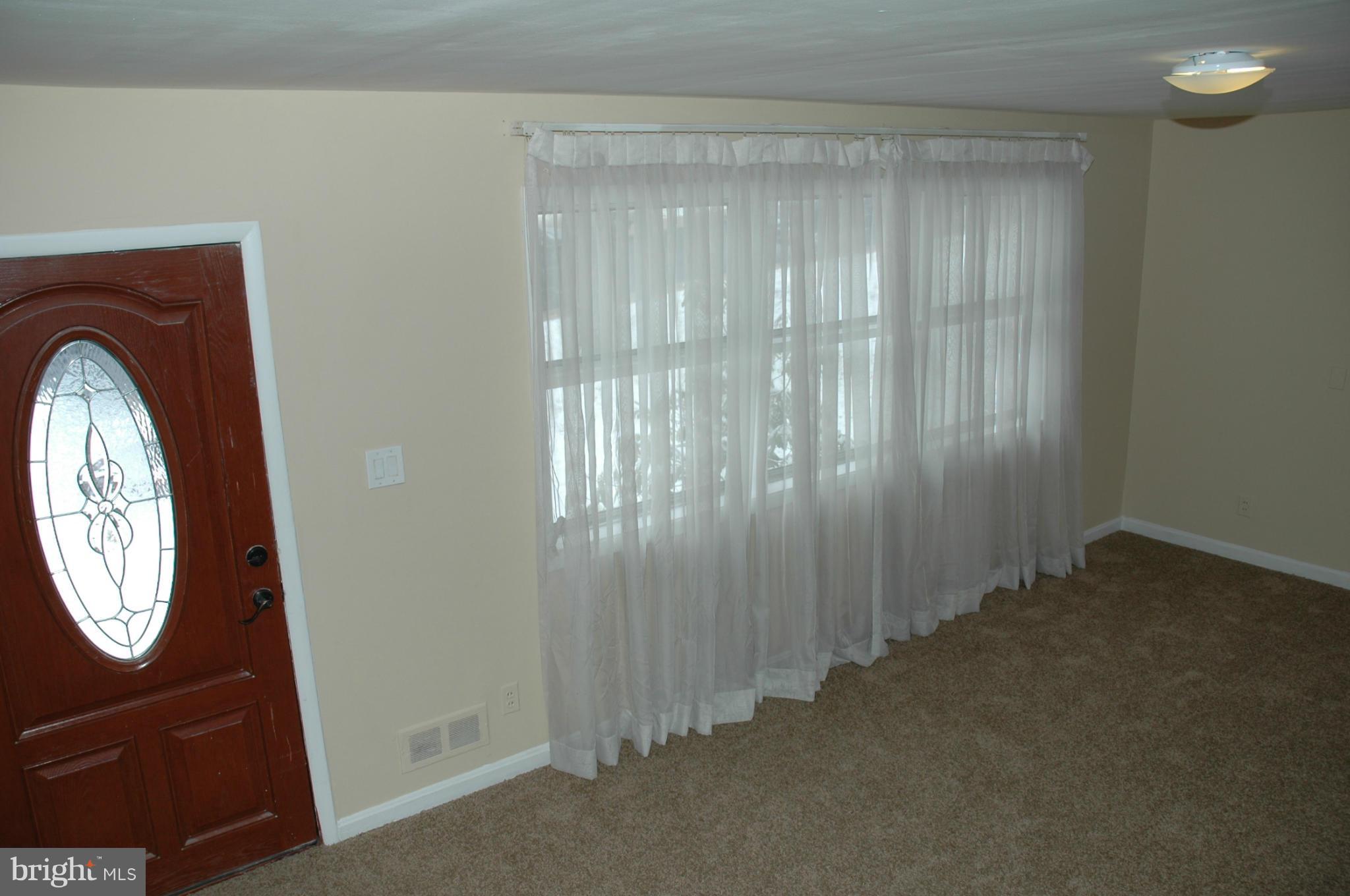 103 Mountain Road Linthicum, MD 21090 - Photo 2 of 17 a view of livingroom with furniture and a window