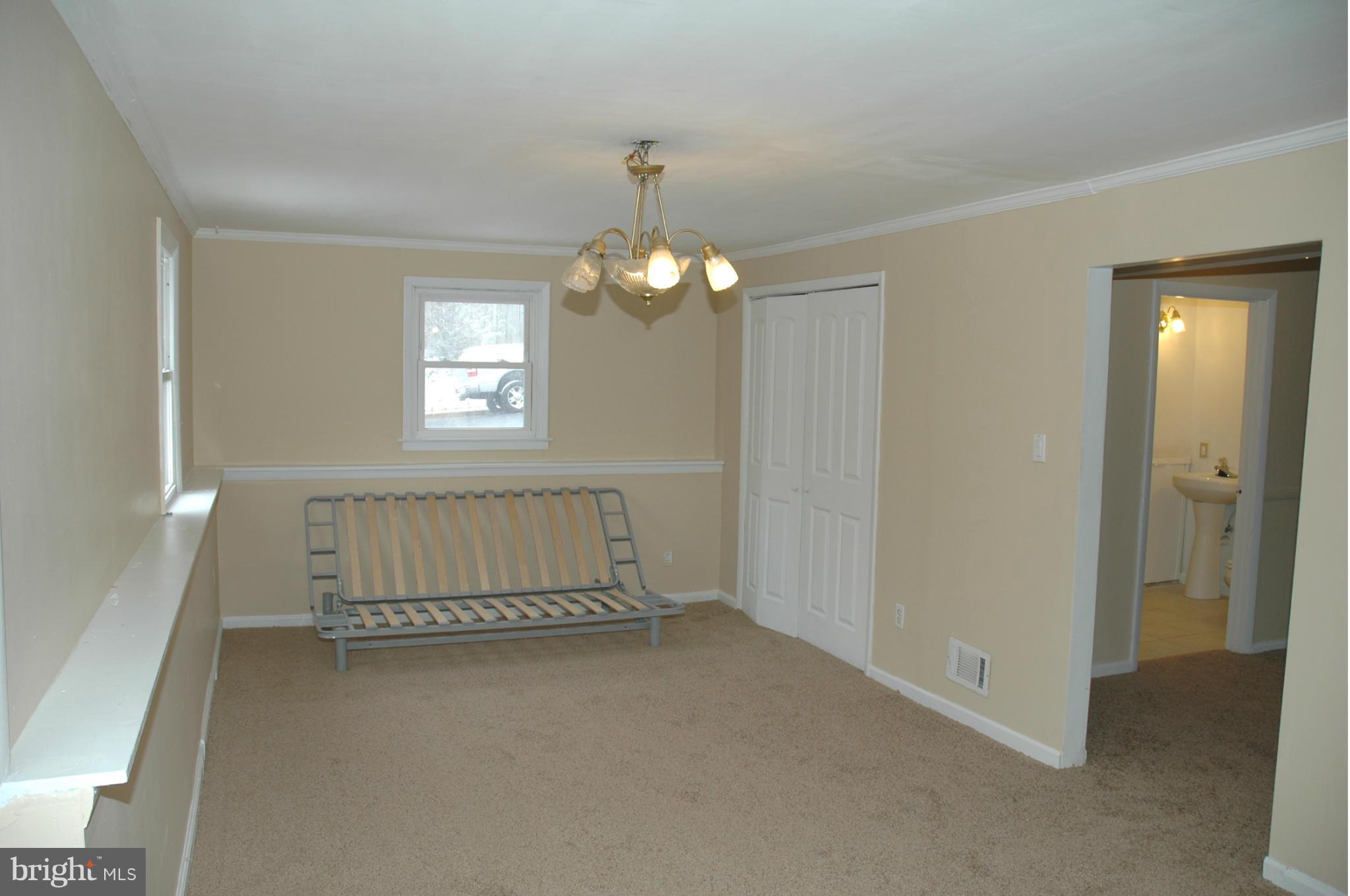 103 Mountain Road Linthicum, MD 21090 - Photo 13 of 17 wooden floor in an empty room with a window