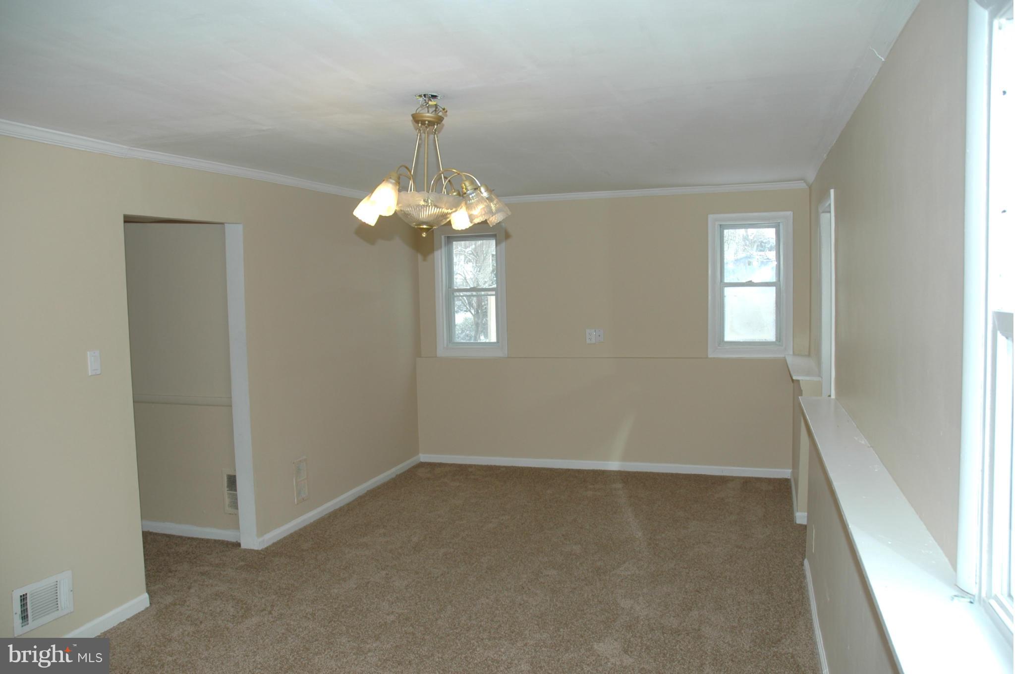 103 Mountain Road Linthicum, MD 21090 - Photo 14 of 17 wooden floor in an empty room with a window