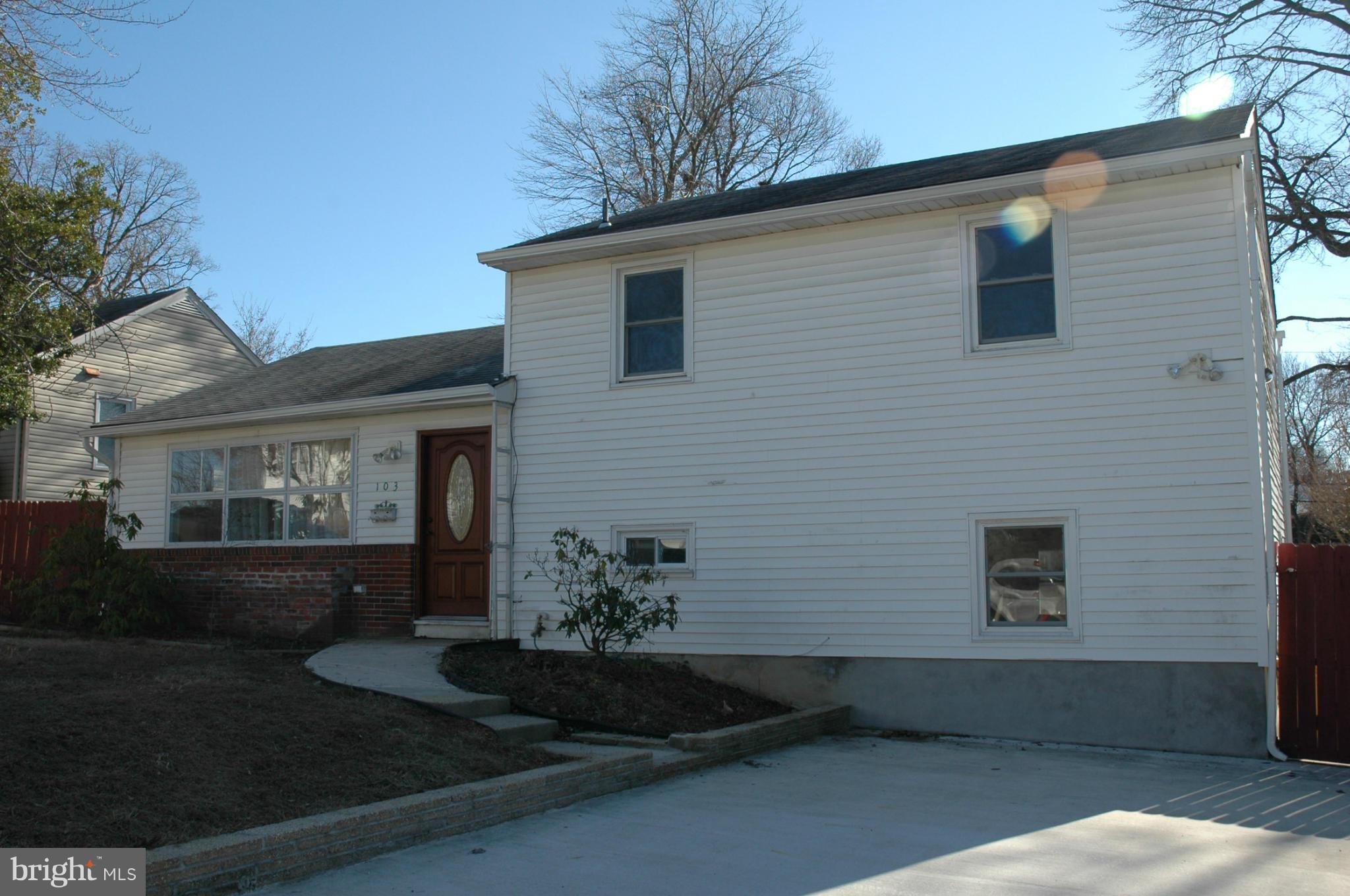 103 Mountain Road Linthicum, MD 21090 - Photo 15 of 17 a front view of a house with garden